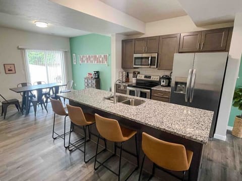 Large kitchen island and fully stocked kitchen