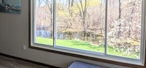 Panoramic view to the spacious backyard with creek for you to enjoy!