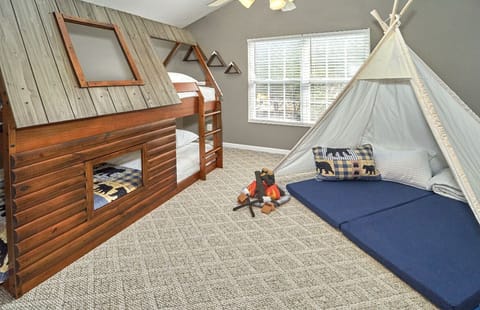Log cabin bunk bed and a large teepee that can comfortably sleep 2 children.