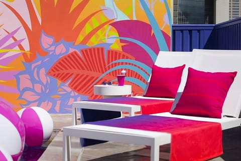 Lounge in the sun with colorful, resort-style poolside seating.
