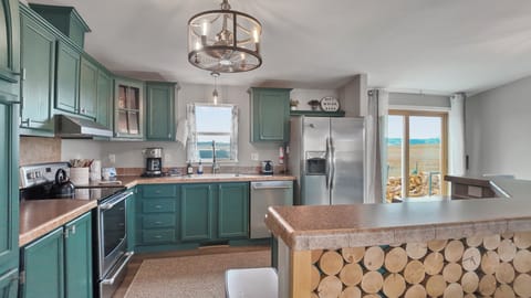 Rustic kitchen with log-accent island