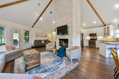 View of living room, dining area, and kitchen