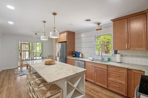 The kitchen features an island perfect for breakfast as well as a table with a view of the lake.  A keurig and a drip coffee maker is available as well as any utensils you may need for cooking.