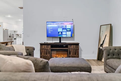 Living Room with electric LED fireplace. As pictured in corner, full body mirror
