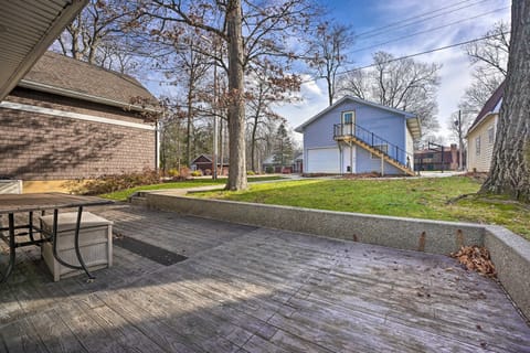 [Front Patio] Large umbrella and bench table are here during the warm weather.
