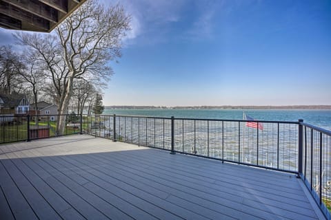 [Spacious Upper Deck] Patio table, chairs and umbrella are located here during the warm weather.