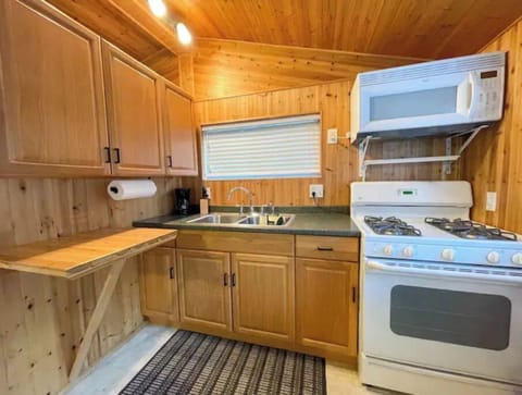 Full kitchen with dishes, cookware, utensils, blender, toaster, & more provided!