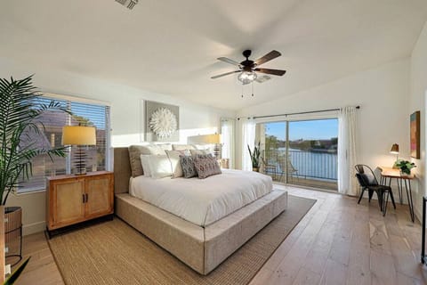 Sun-drenched primary suite located upstairs with long lake and mountain views from your private balcony.