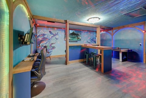 Game room with bar & ocean mural