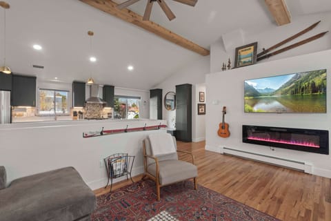 1 of 2 fireplaces. 65" Smart TV