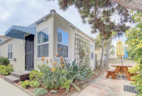 Exterior view of the villa. Picnic table and BBQ for outdoor dining. 