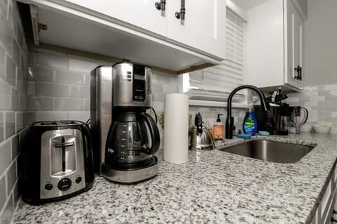 Countertop with Coffee Maker and Toaster
Start your day right with a fully equipped countertop featuring a coffee maker and toaster. Whether it’s a morning brew or a quick breakfast, everything you need is right at your fingertips.