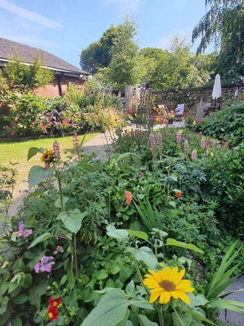 Large communal flower garden and large patio