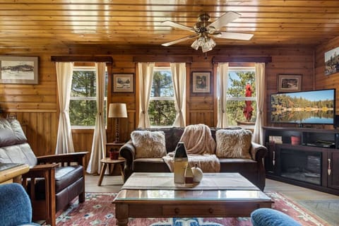 Floor to ceiling wood interiors with cozy, comfortable, and new furniture throughout the home including a Smart TV to stream your favorite shows!