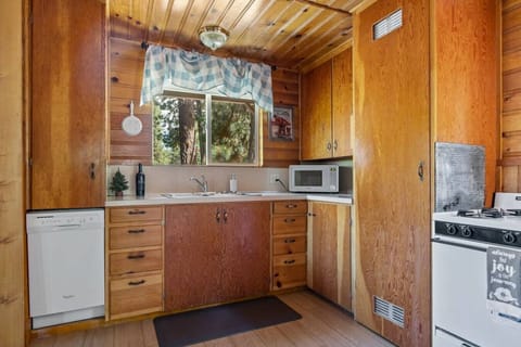 Kitchen features a dishwasher and microwave.