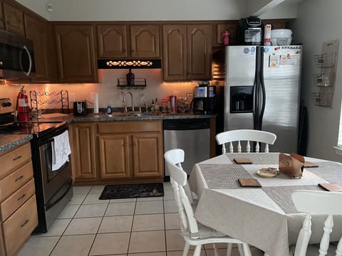Full Kitchen with stove, oven, microwave, dishwasher & refrigerator/freezer. 