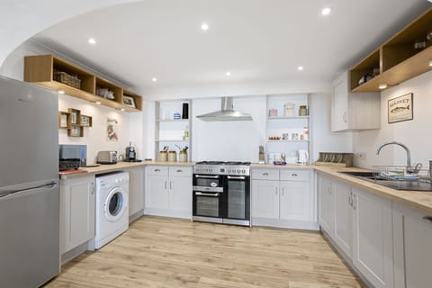 Open modern fitted kitchen leading to dining area