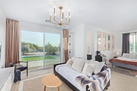 The main living area has an oversized sliding glass door leading to yard. 