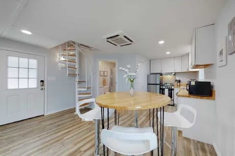 Modern bar-style seating creates an intimate breakfast nook.