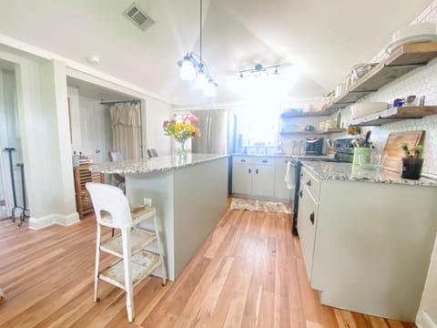 Full kitchen with island, full refrigerator, stove, oven, and microwave!