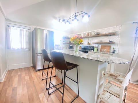 Full kitchen with island, full refrigerator, stove, oven, and microwave!
