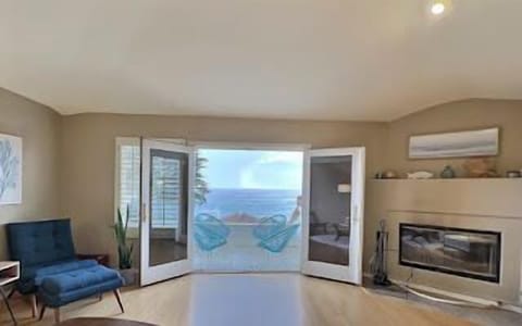 French doors open wide, extending indoor living space.