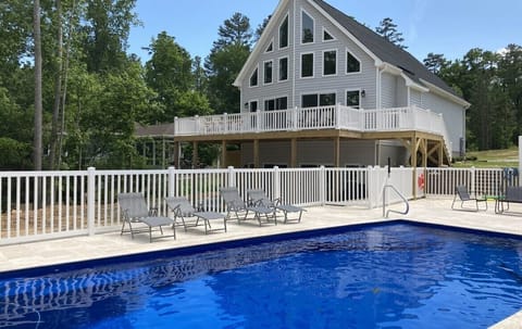 Heated salt water pool with fence, great times for the family.  Lakefront home!