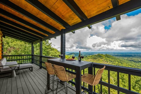 Enjoy cocktails and snacks at this high-top bistro table overlooking the view! 
