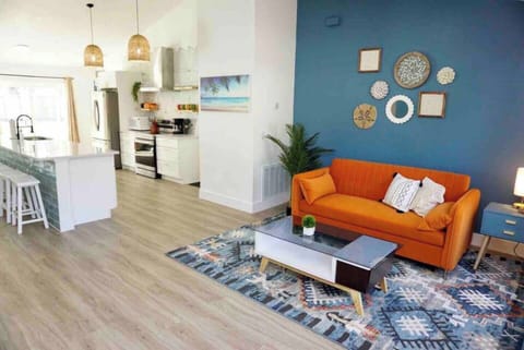 Living room: Our home boasts an open layout where you can sit and lounge by the couch or eat by the dining table or just mingle while preparing for dinner. It’s a personal favorite too!