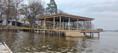 Boat house with boat lift. Great for fishing and swimming. No diving please.