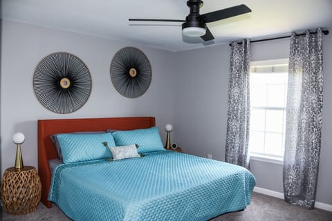 Comfortable plush King bed in master bedroom 