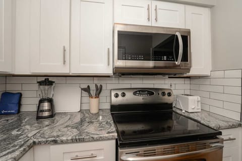 Our spacious kitchen is a chef’s dream—ample counter space, full appliances, and everything you need to whip up culinary delights.