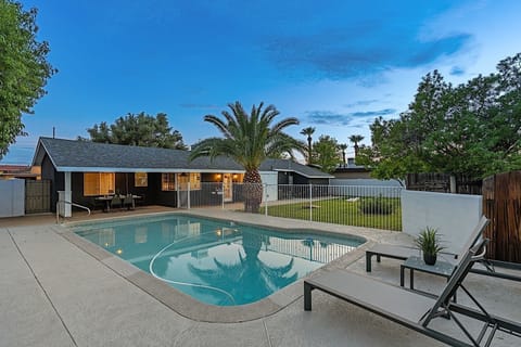 Sparkling pool and sun loungers