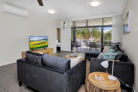 Living Room: Bright and airy with modern furnishings and a scenic patio view for ultimate relaxation!