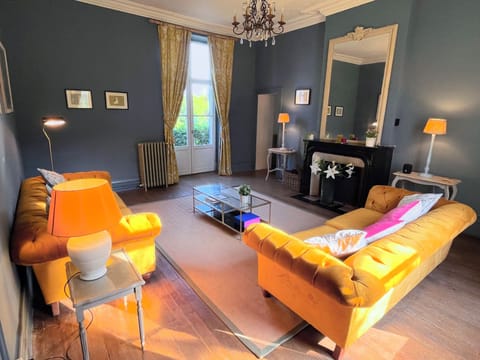 Main living room with large French doors to the front and rear.