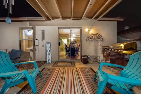 Covered back patio for relaxing and grilling