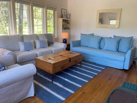 A cozy, yet expansive lounge, with lots of natural sunlight