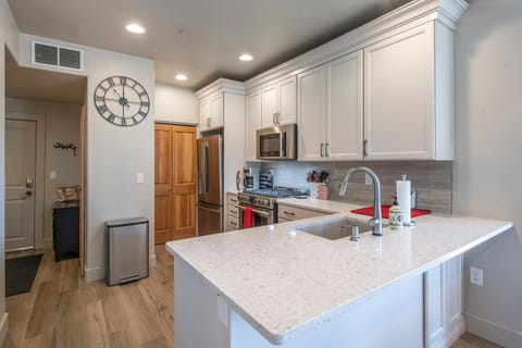 Redesigned modern kitchen offers new countertops, cabinets, and appliances