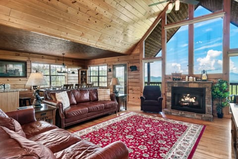 Main level living space, extra high-ceilings, 2 comfy sofas, big screen.
