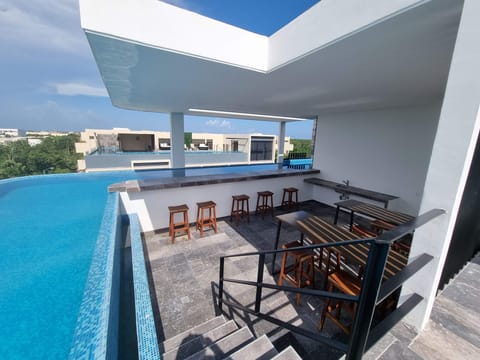 pool-sky-view-table-bar-chairs-cocktail-room-outside-common-area
