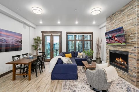 Great Room with fireplace, TV, dining