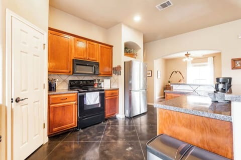 Stocked with all essentials. Bar, dining room & dining nook adjacent.