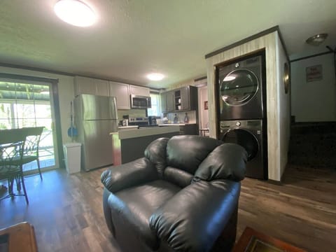 Overview from living to kitchen and notice the stack washer/drier there