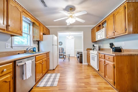 Full sized kitchen with stove, dishwasher, refrigerator, oven and microwave.