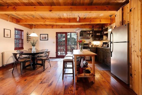 Kitchen and dining area with view to the back deck