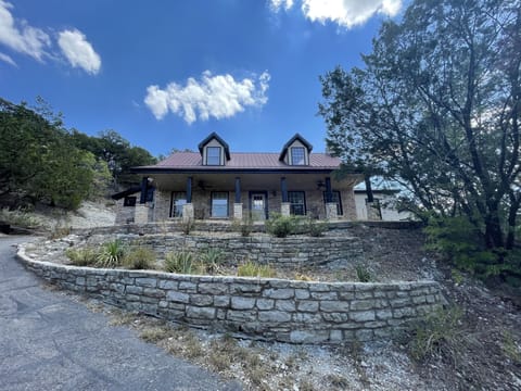 The front of the house where the rocking chairs reside