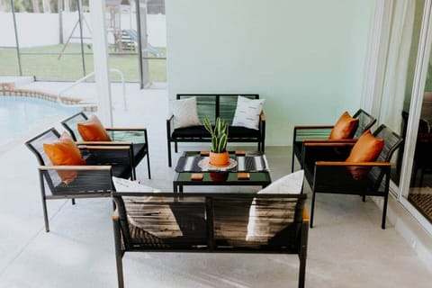 Relax in the shaded veranda. Perfect for watching the kids play in the pool, surrounded by tropical landscaping, with a killer sunset in the evening!! (The sun sets over the pool, flooding the lanai with a golden glow. Nothing quite like it!!)