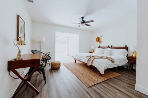 Master King bedroom with attached full bath, and view of the pool (sliding door). Newly outfitted with lightweight quilts. 