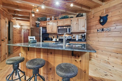 Bar seats and kitchen