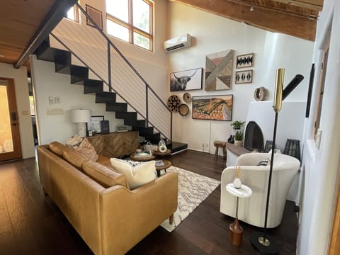 Open Living area with loft above. Ample
lighting from the East, South and North.